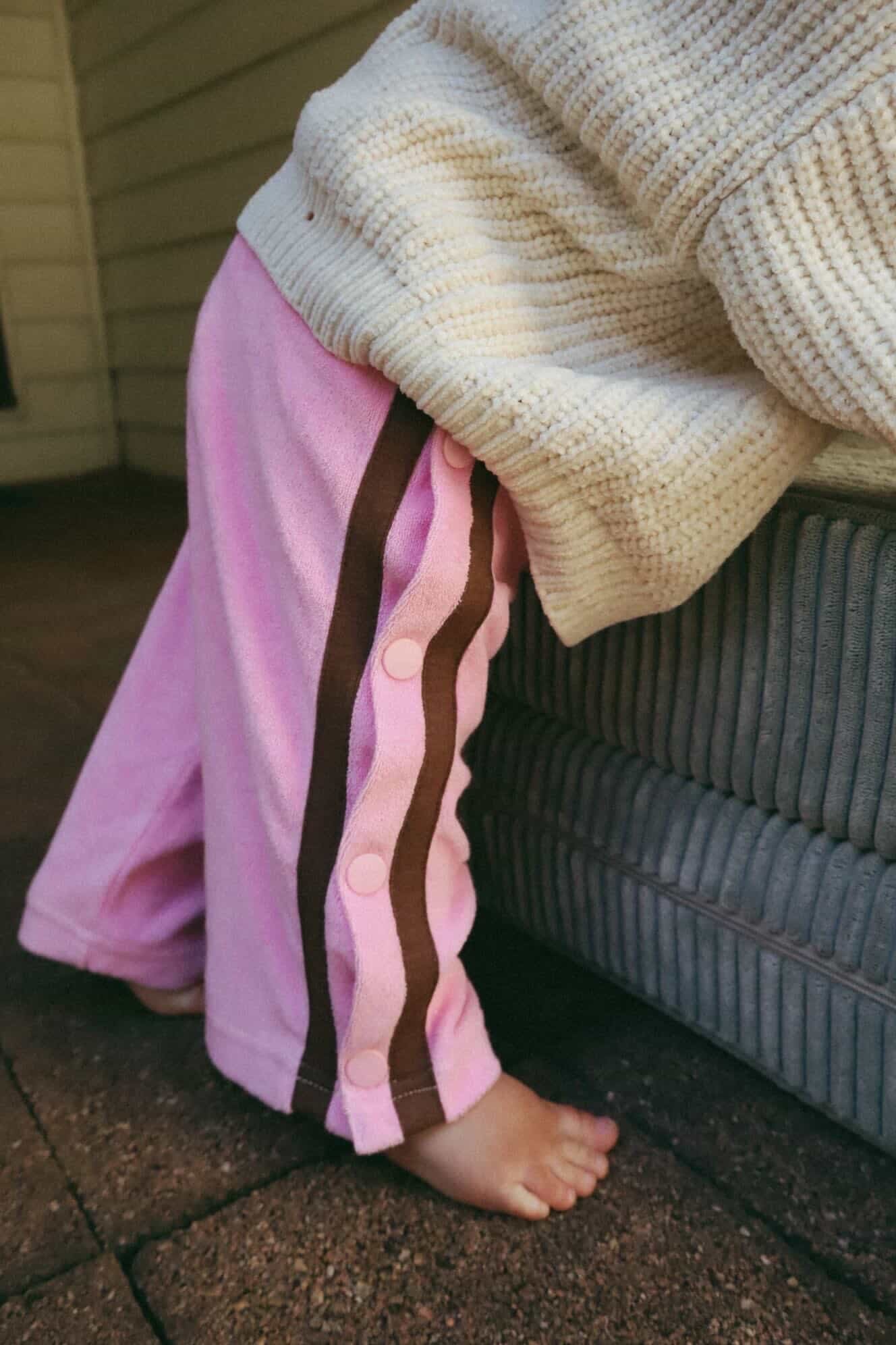 Designed with easy snap buttons for that retro edge and everyday practicality, they’re made to keep up with playground adventures and slow Sunday cuddles. Lightweight, comfy and effortlessly iconic — just how kidswear should be.